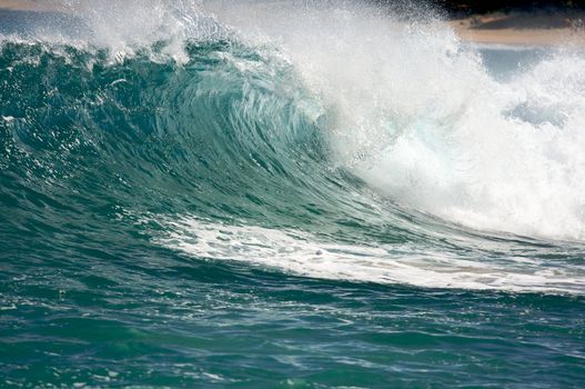 Dramatic Shorebreak Wave on a clear morning.