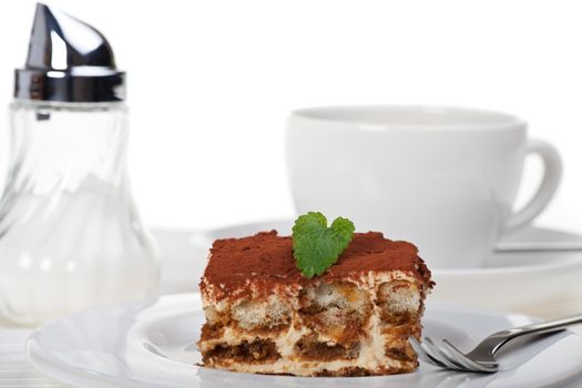 tiramisu cake with a cup of coffee