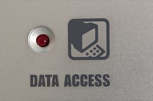 Close up of an electrical panel with a red light and the words 'data access' and an icon.