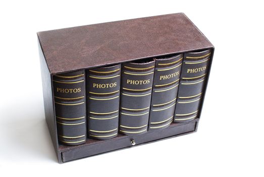 Five photo books in mini bookcase isolated on white background