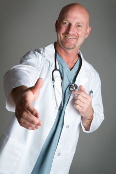 Smiling doctor shaking hands
