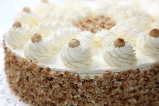 Cream cake with almond edge - close-up