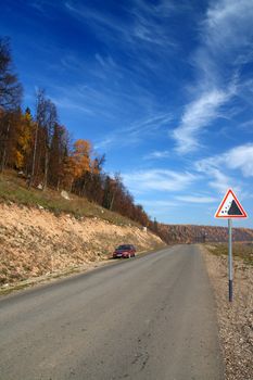 autumn landscape with road in Ural mountains Russia