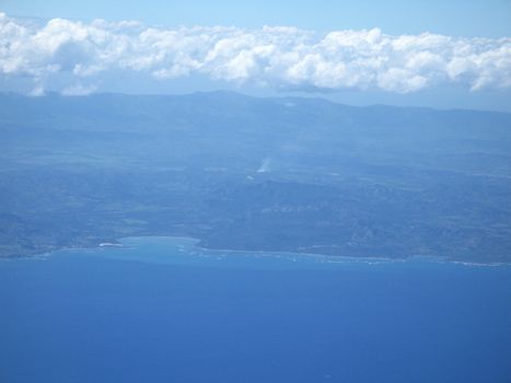 ocean and land viewed from a plane