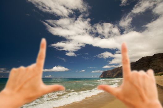Hands Framing Polihale Beach on Kauai, Hawaii