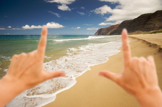 Hands Framing Polihale Beach on Kauai, Hawaii