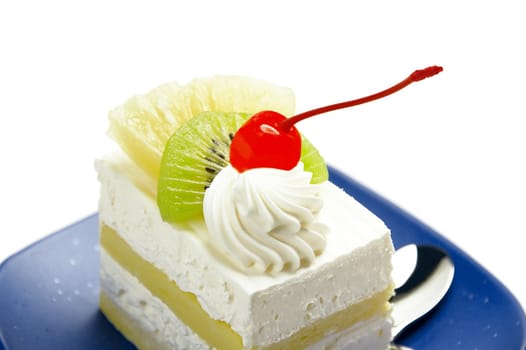 piece of fresh fruit cake on white background