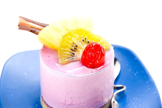 piece of fresh fruit cake on white background