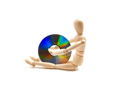 wood mannequin with CD-rom on white background