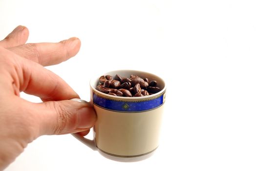 cup of coffee beans on white background