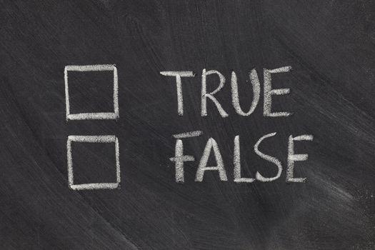 true or false with checkboxes - white chalk handwriting on blackboard
