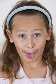 little girl showing her tongue