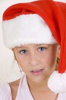 smiling little girl wearing christmas hat