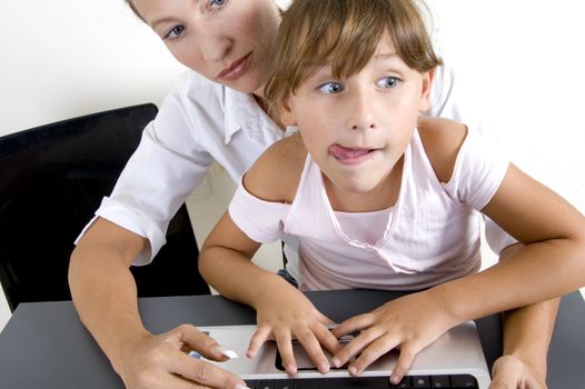 american mother with daughter working on laptop