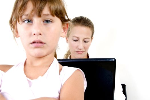 cute girl and her mother working on notebook