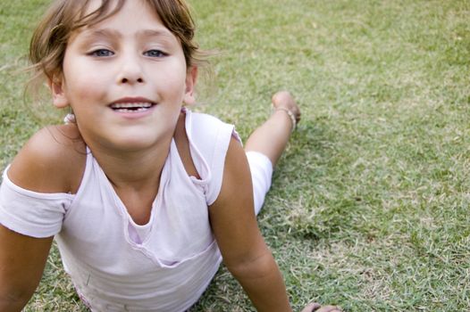 happy young girl playing in the garden