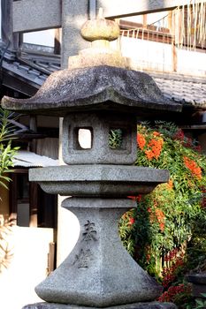 A stone lamp in a Japanese town 
