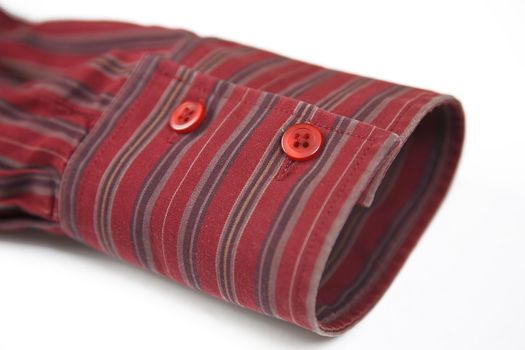 close up of the red cuff from striped shirt