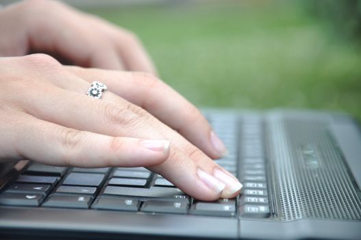 girl typing on keyboard
