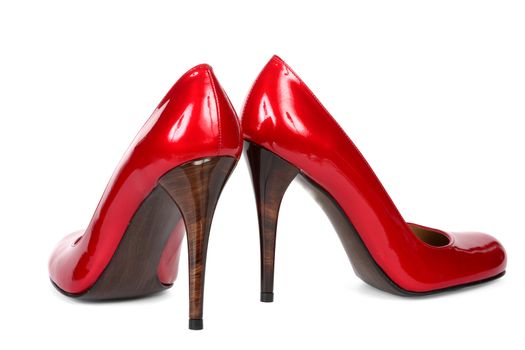 Red female shoes on a high heel. It is isolated on a white background