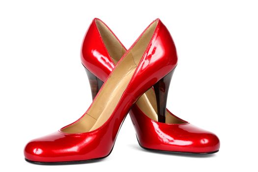 Red female shoes on a high heel. It is isolated on a white background