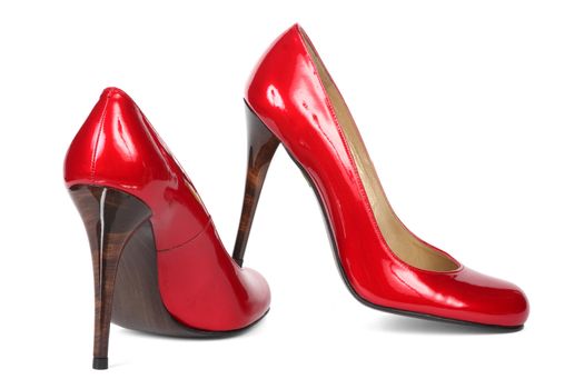 Red female shoes on a high heel. It is isolated on a white background