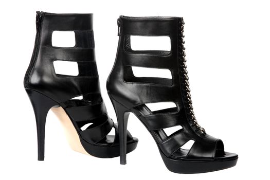 Black female shoes on a high heel. It is isolated on a white background