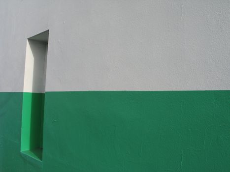 door on a white and green building