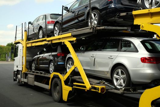 Semitrailer transporting new cars. Export-import of goods.