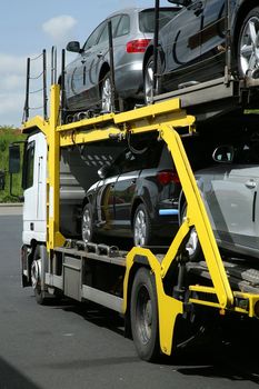 Semitrailer transporting new cars. Export-import of goods.