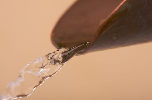 Custom Copper Faucet and Water Close-up.