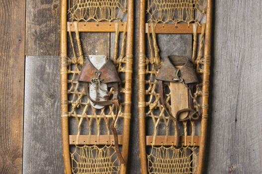 Antique Snowshoes on Rustic Cabin Wall