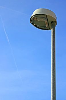 This image shows a modern street light with sky