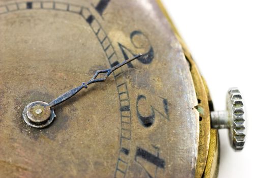 Part of antique wristwatch with minute hand on white background