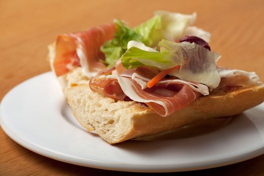 ham sandwich with salad leaves