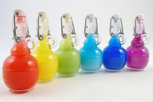 Colorful closed flask disposition, from red to purple