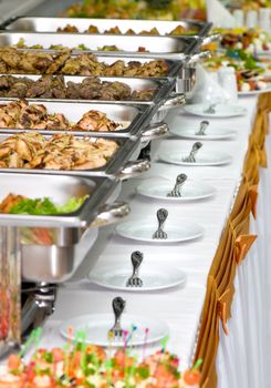 metallic banquet meal trays served on tables