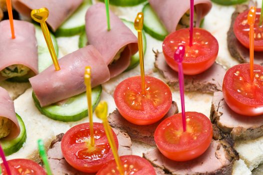 canape tray closeup � meat, cucumber, ham, tomatoes