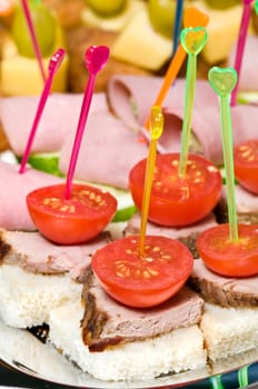 canape tray closeup � meat, tomatoes, ham, cucumber