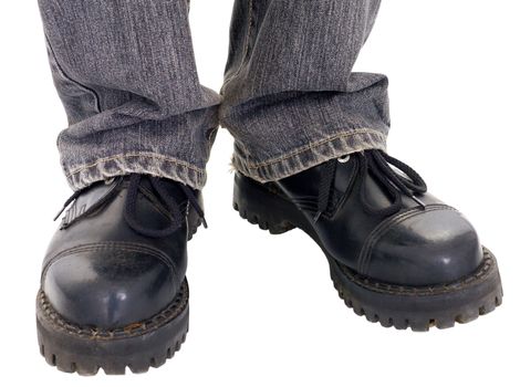 Man's feet in the big black boots on a white background