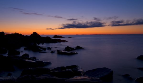 Lake Superior and stones before dawn at Brighton beach in Duluth Minnesota