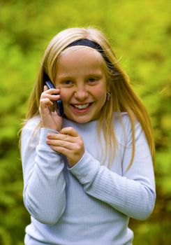 Good news received by a young girl on a cell phone