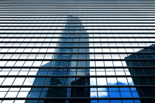 Business buildings reflection with blue sky