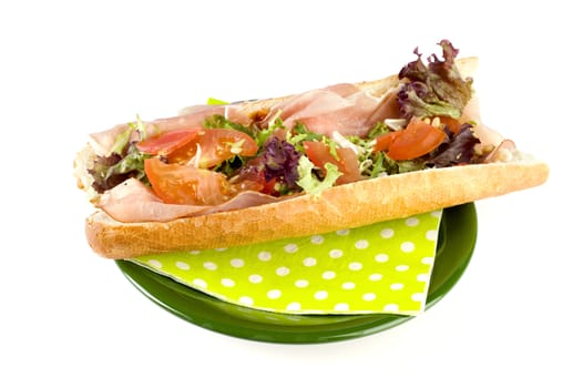a fresh and healthy baguette with ham and vegetables