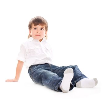 Young adorable boy sitting on isolated white
