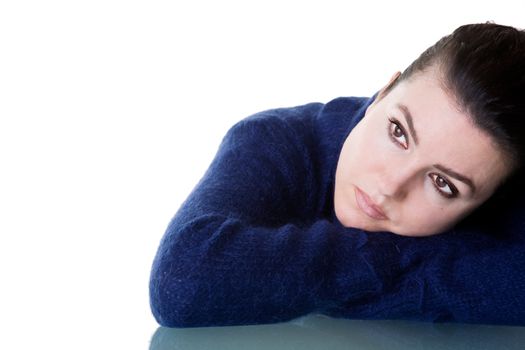 Beautiful woman with thoughtful look. Isolated on white background.