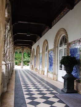 Vintage palace cloisters with blue tiles on the wall