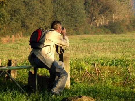 Photographer preparing a nice shot of landscape