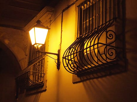 Photo of a window and a lamp from old town