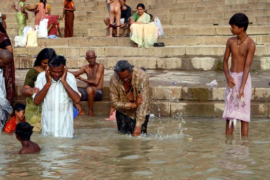 Religious ceremony (washing in holy river) at Varanasi Uttar Pradesh India